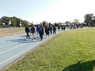 Students walking a mile around the track