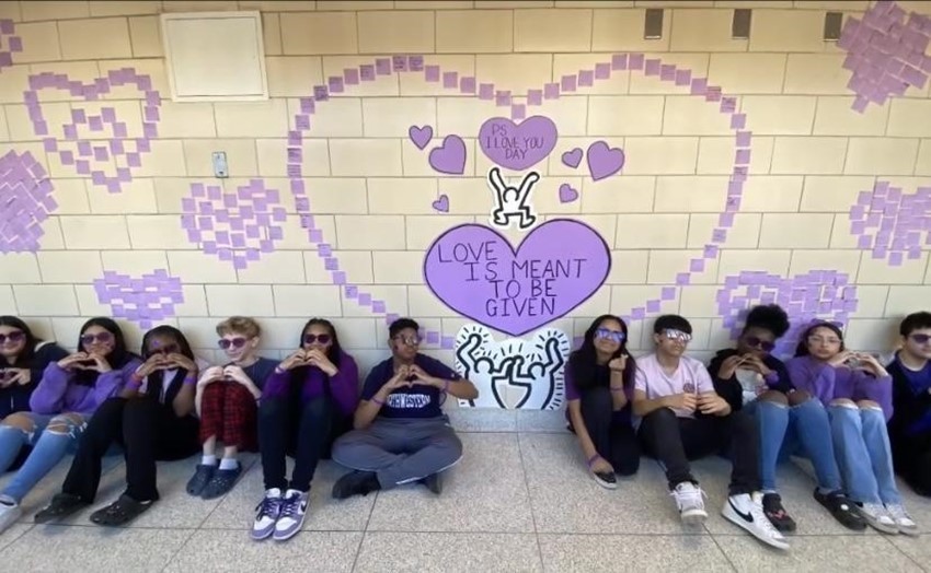 Students Sitting Against Wall